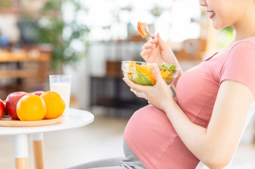 pregnant woman eating healthy food