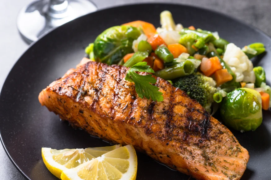 Grilled salmon with side of vegetables