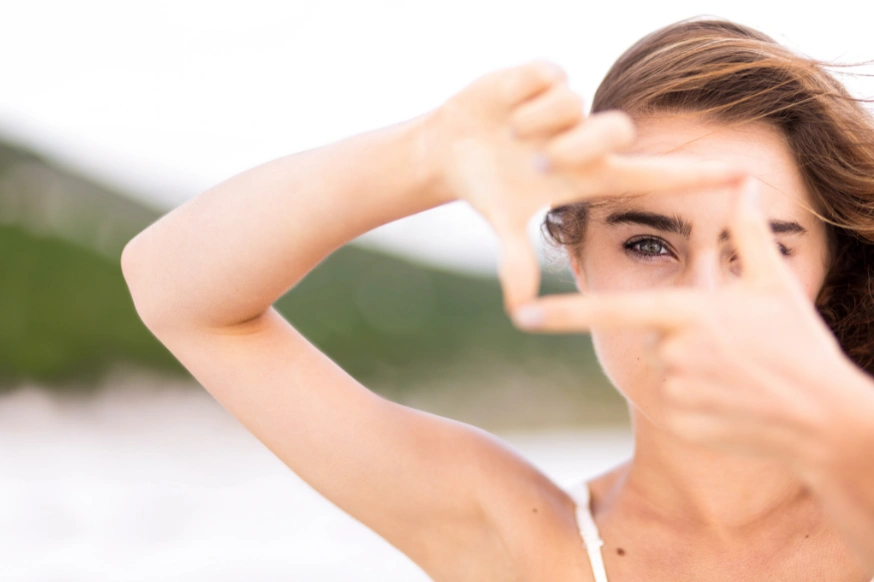 Woman looking through her hands