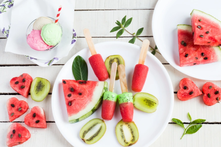 plates of watermelon and kiwi