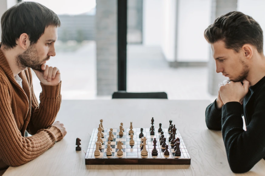 Two men playing chess as their hobby