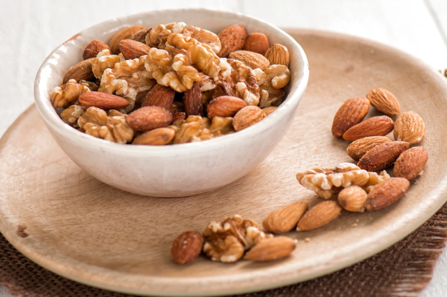 Bowl of mixed nuts, including walnuts and peacans